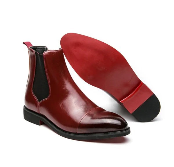 Burgundy slip-on boots pair with the red sole shown beside the standing boot