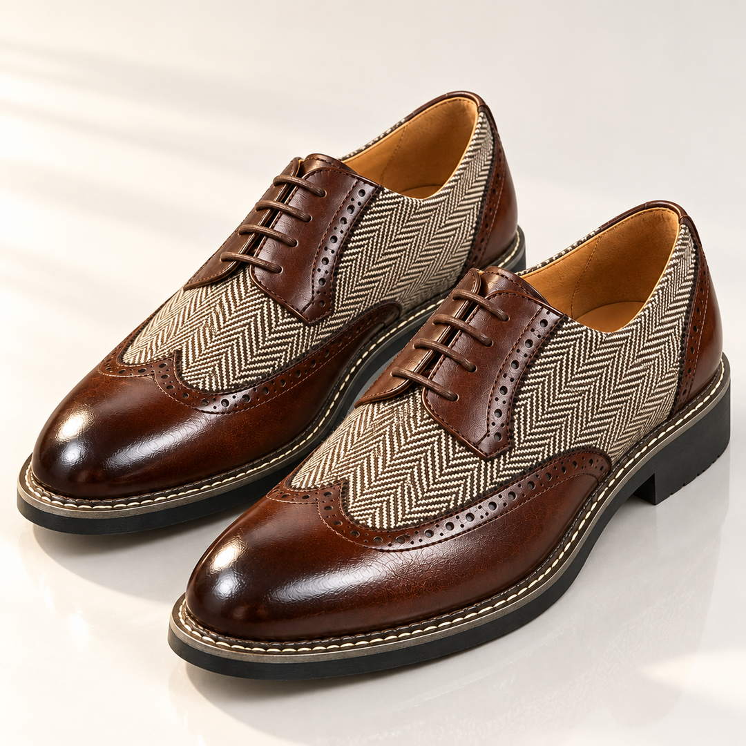 Pair of brown brogue dress shoes with glossy toe caps and herringbone panels