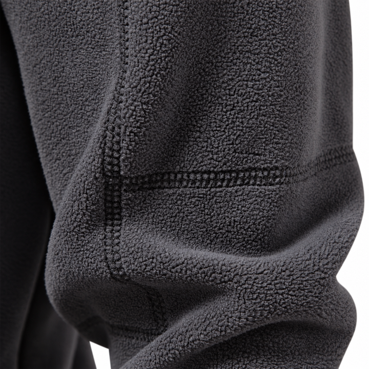 Close-up of the charcoal fleece sleeve with stitched seam detail