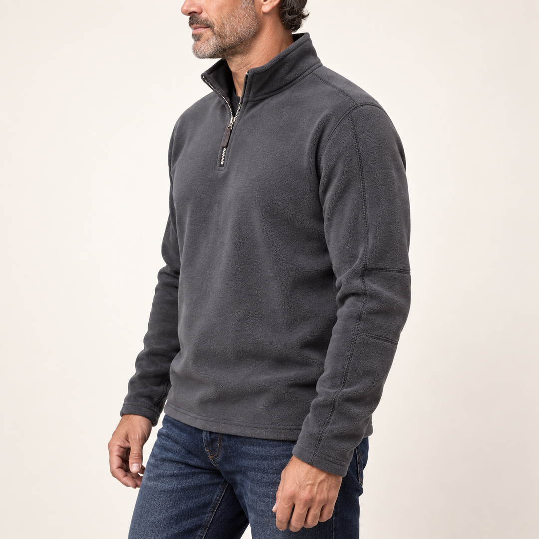Side angle of a man in the charcoal fleece quarter zip with stand collar