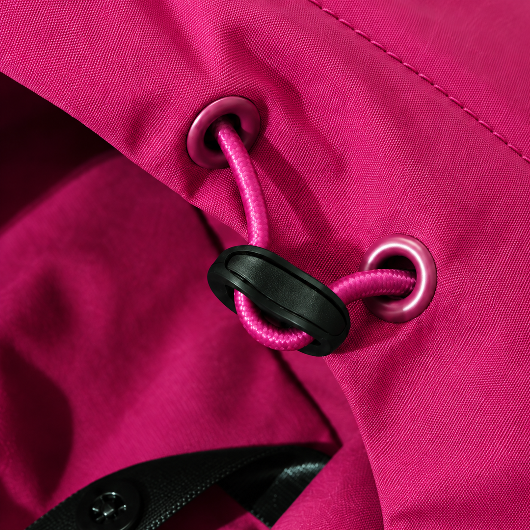Close-up of the drawcord and cord stopper on the pink jacket hem