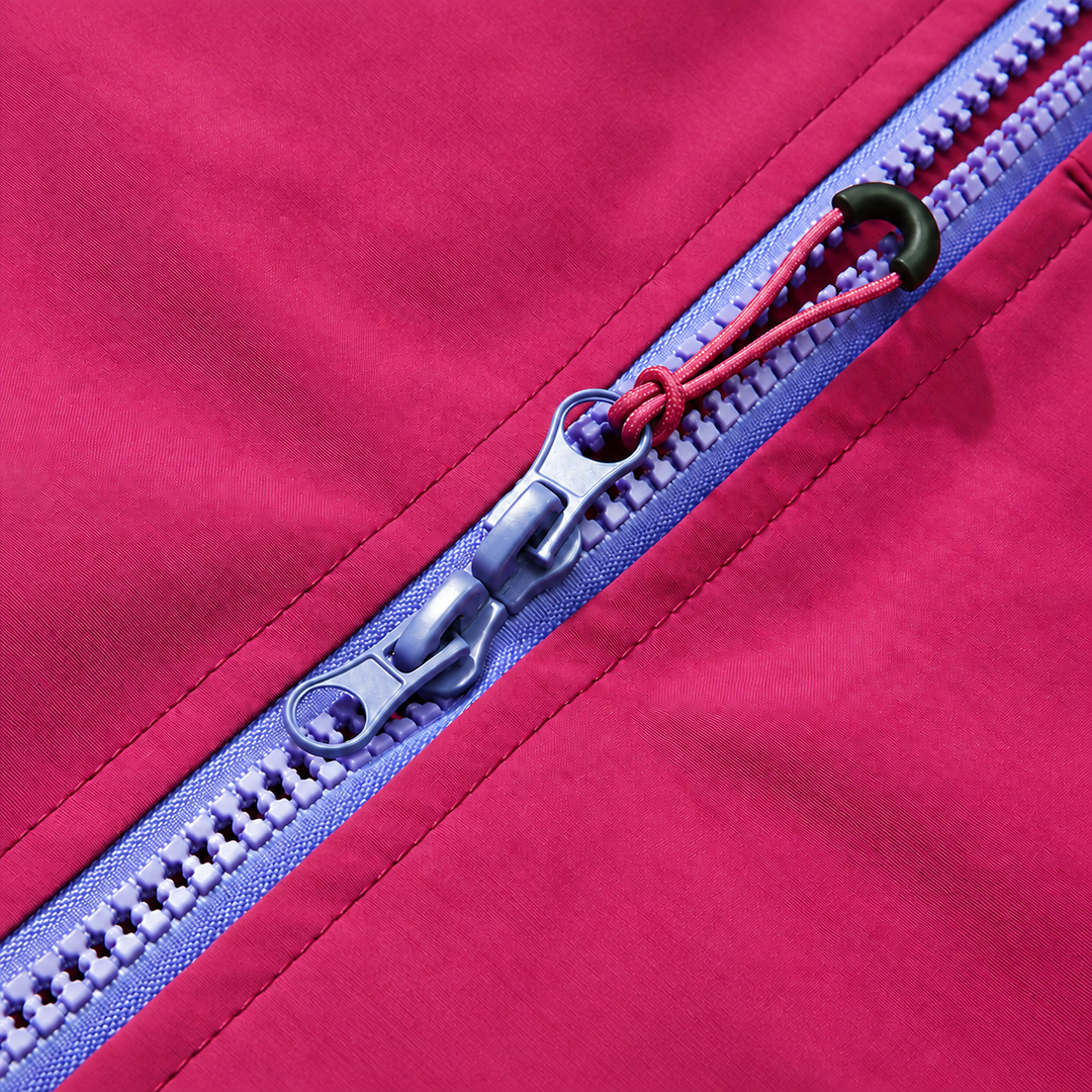 Close-up of the purple two way zipper and pull on the raspberry jacket