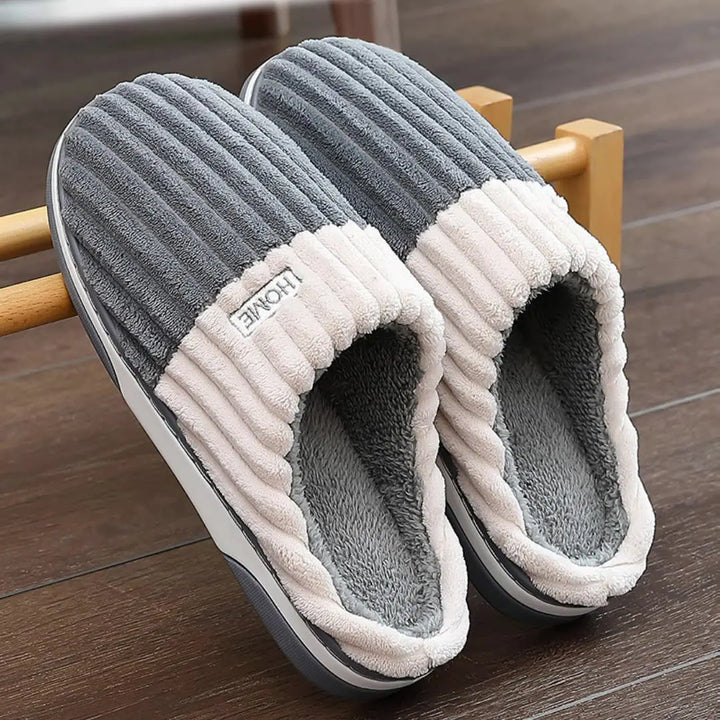 Pair of slate gray ribbed slippers with cream cuff and soft lining
