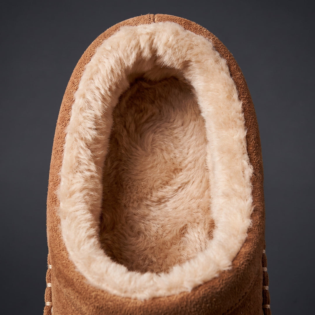 Close-up of the tan moccasin slipper with faux fur lined opening