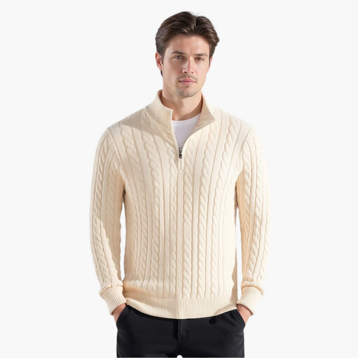 Man wearing a beige cable knit quarter zip pullover, front view