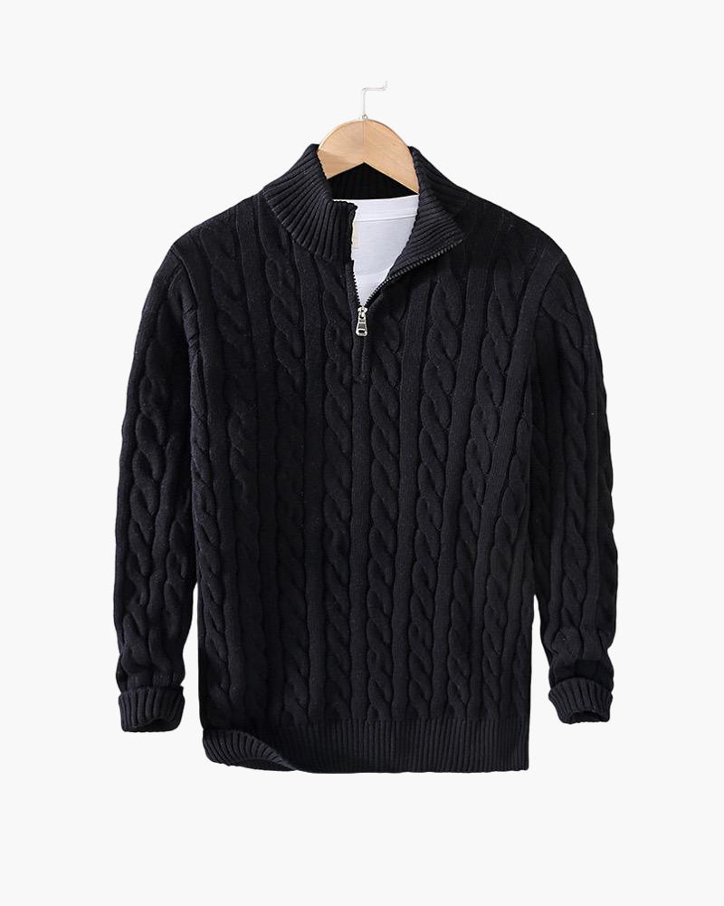 Black cable knit quarter zip pullover on a hanger