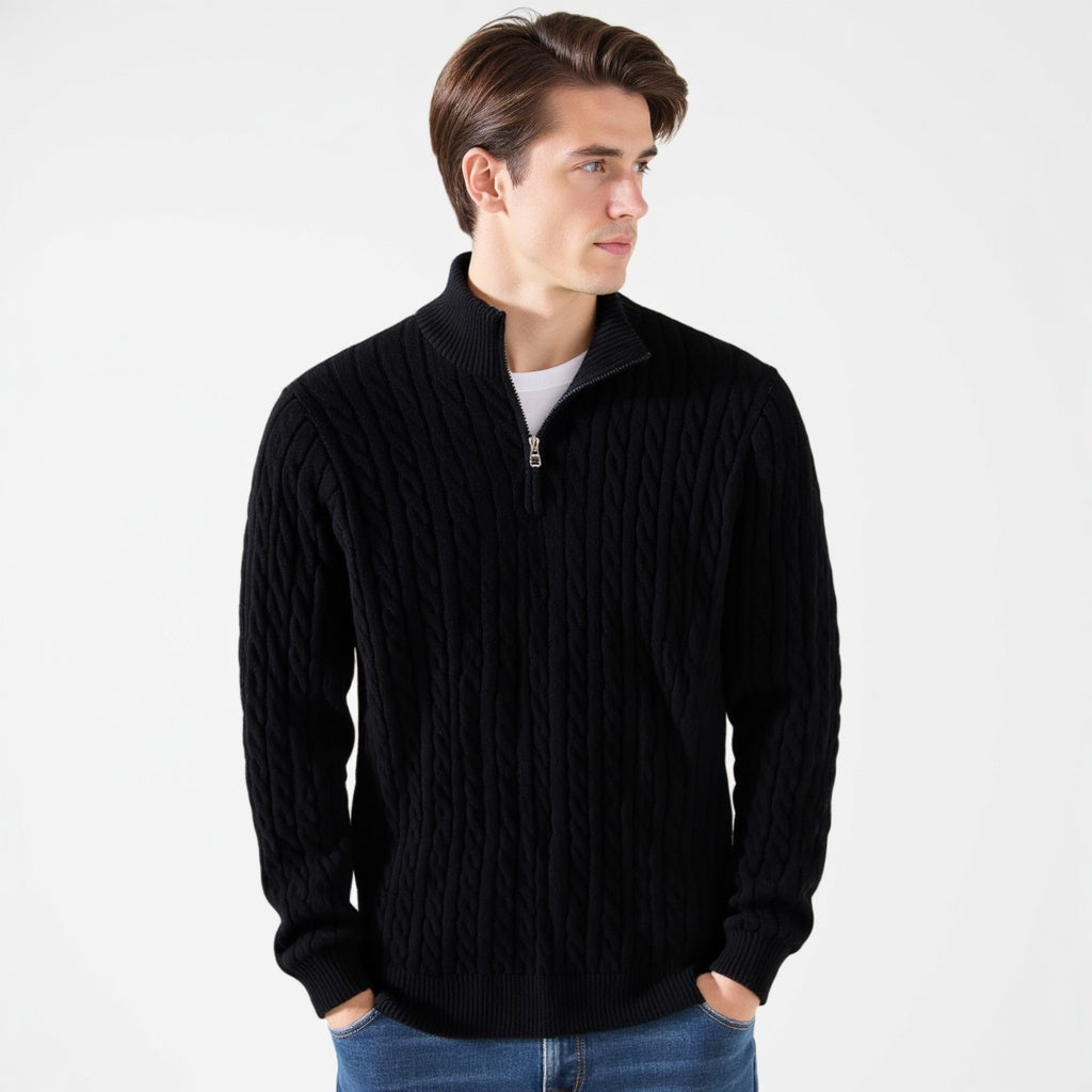 Man wearing a black cable knit quarter zip pullover, front view