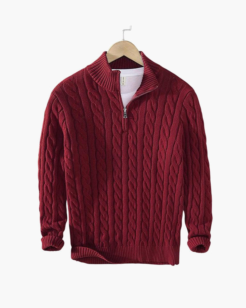 Burgundy cable knit quarter zip pullover on a hanger