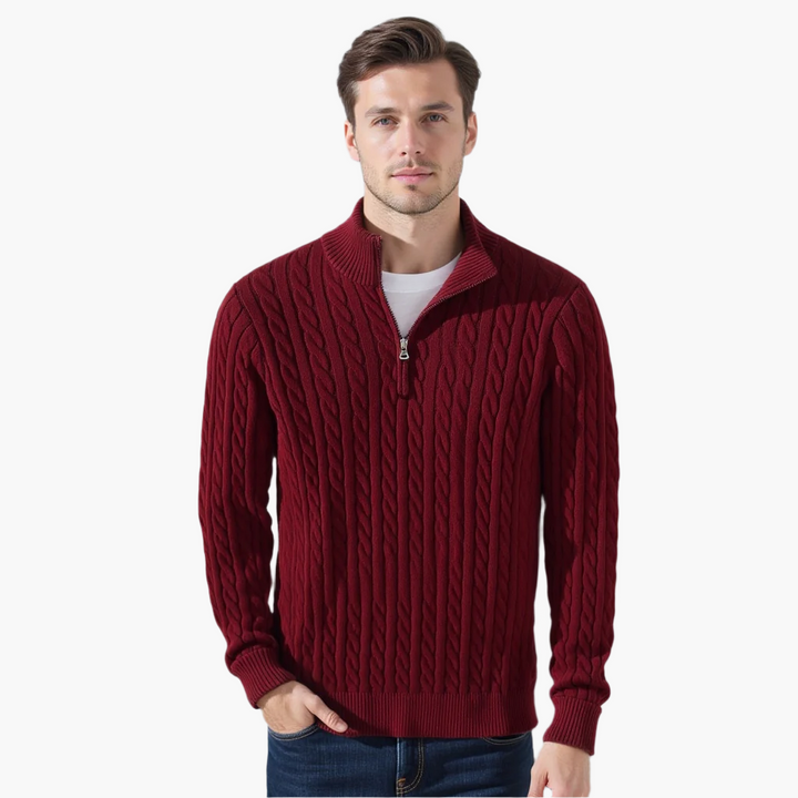 Man wearing a burgundy cable knit quarter zip pullover, front view