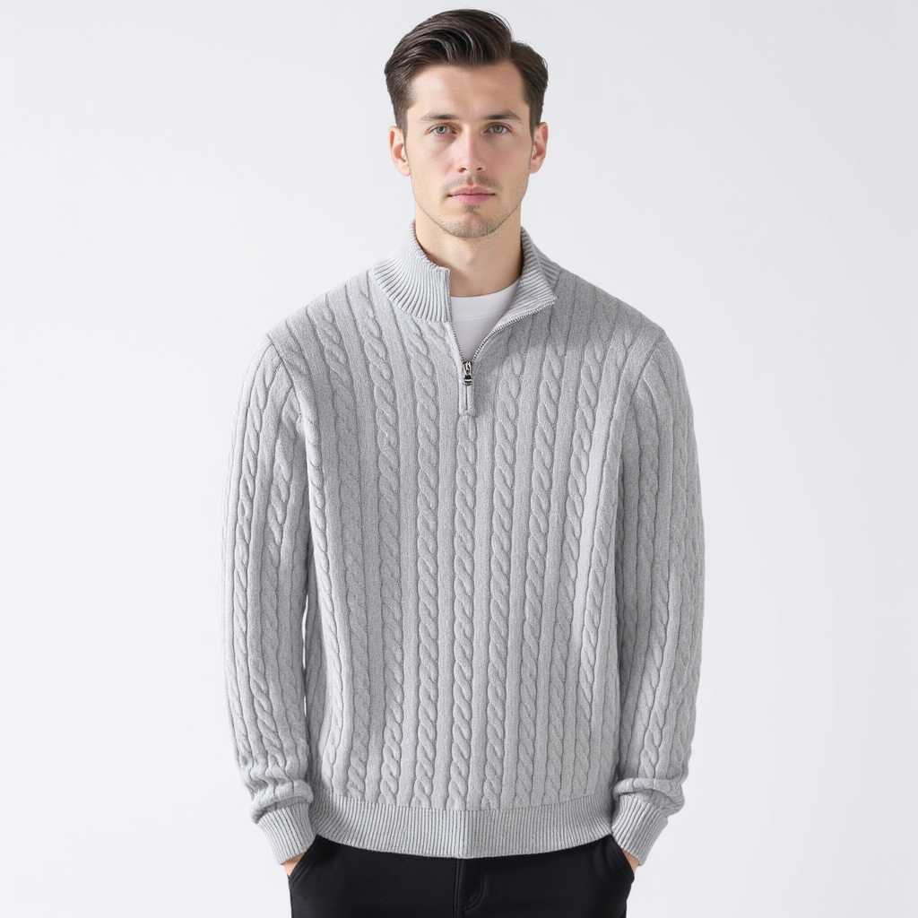 Man wearing a gray cable knit quarter zip pullover, front view