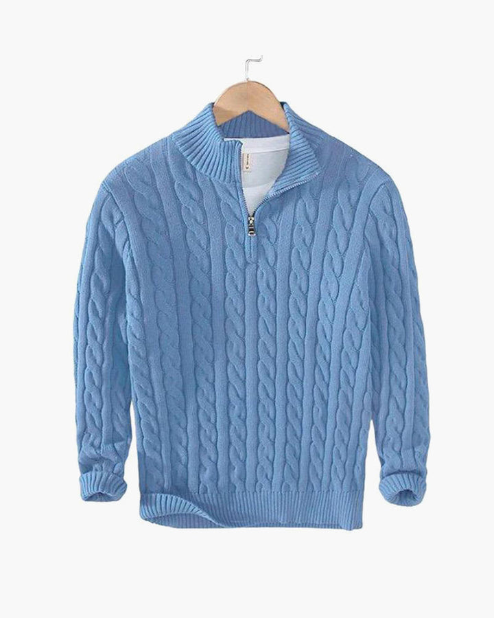 Light blue cable knit quarter zip pullover on a hanger