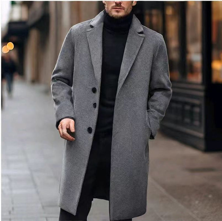 Dark gray overcoat with three buttons and flap pockets