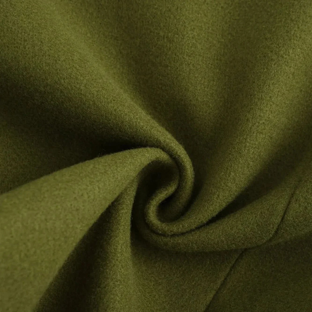 Close up of the olive green coat fabric in a soft swirl