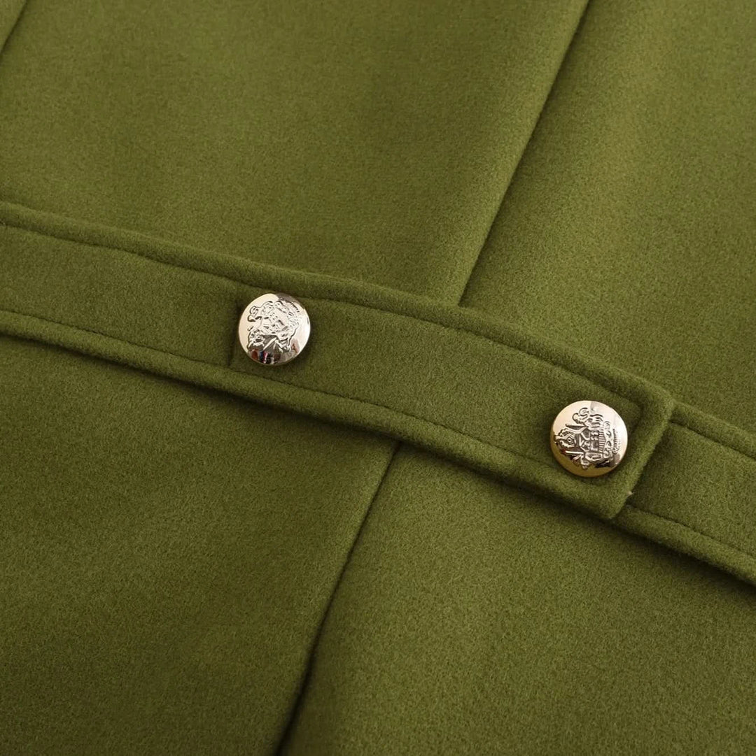 Detail of the olive peacoat back belt with two gold buttons