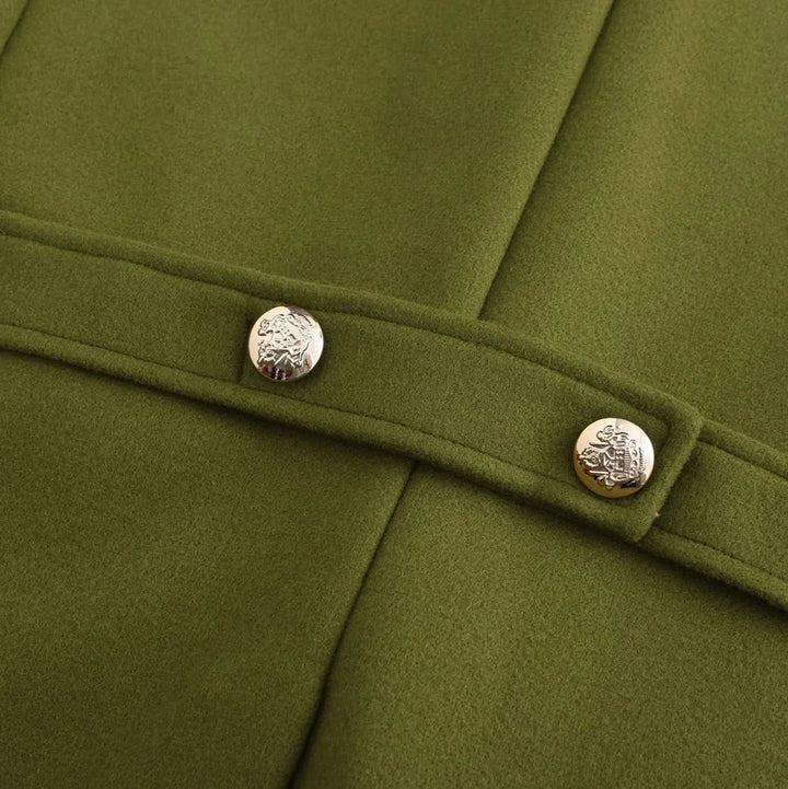 Detail of the olive peacoat back belt with two gold buttons