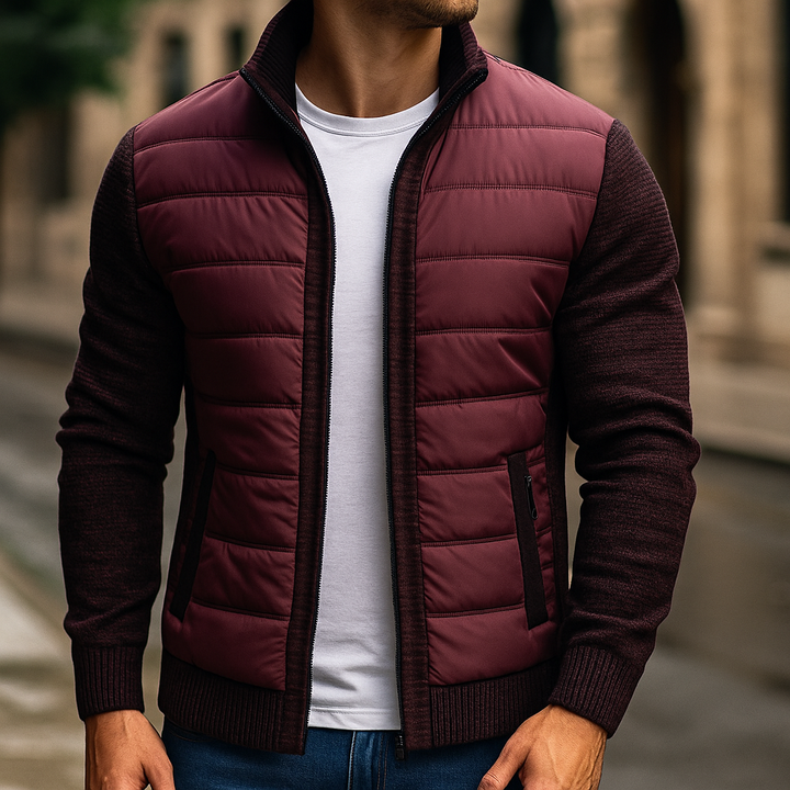 Man wearing the burgundy quilted zip up jacket with knit sleeves, front view