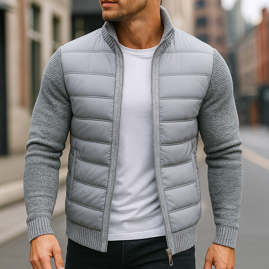 Man wearing the light gray quilted zip up jacket with knit sleeves on a street
