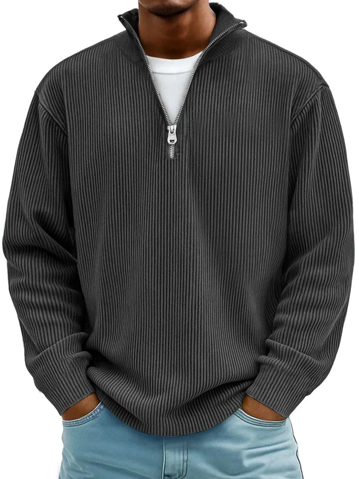 Black ribbed quarter zip sweater, front view with hands in pockets
