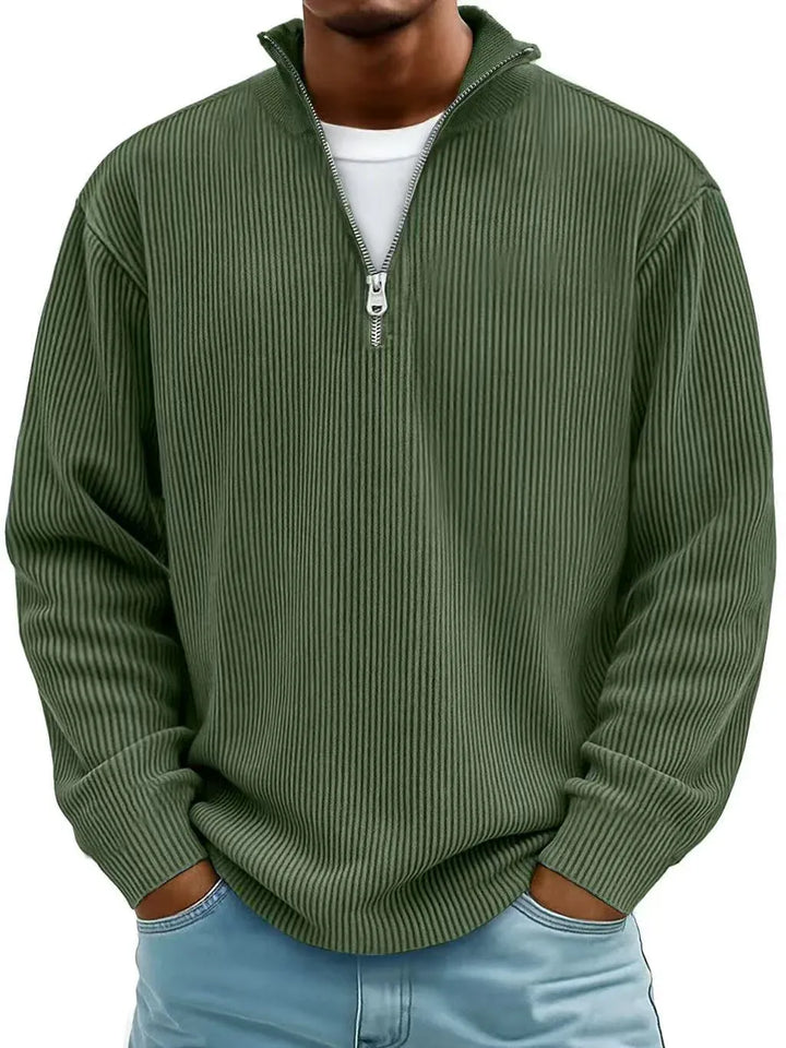 Military Green ribbed quarter zip sweater with stand collar, worn with jeans