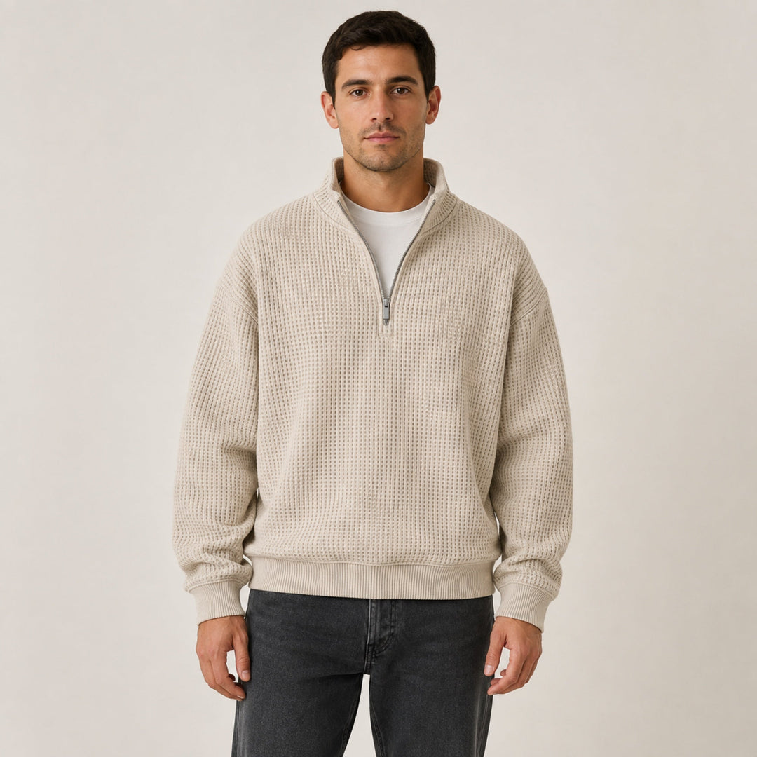 Oatmeal waffle knit quarter zip pullover worn with dark jeans, front view on model