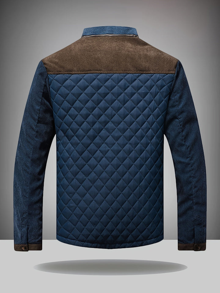 Back view of navy quilted jacket with brown shoulder yoke and diamond stitching