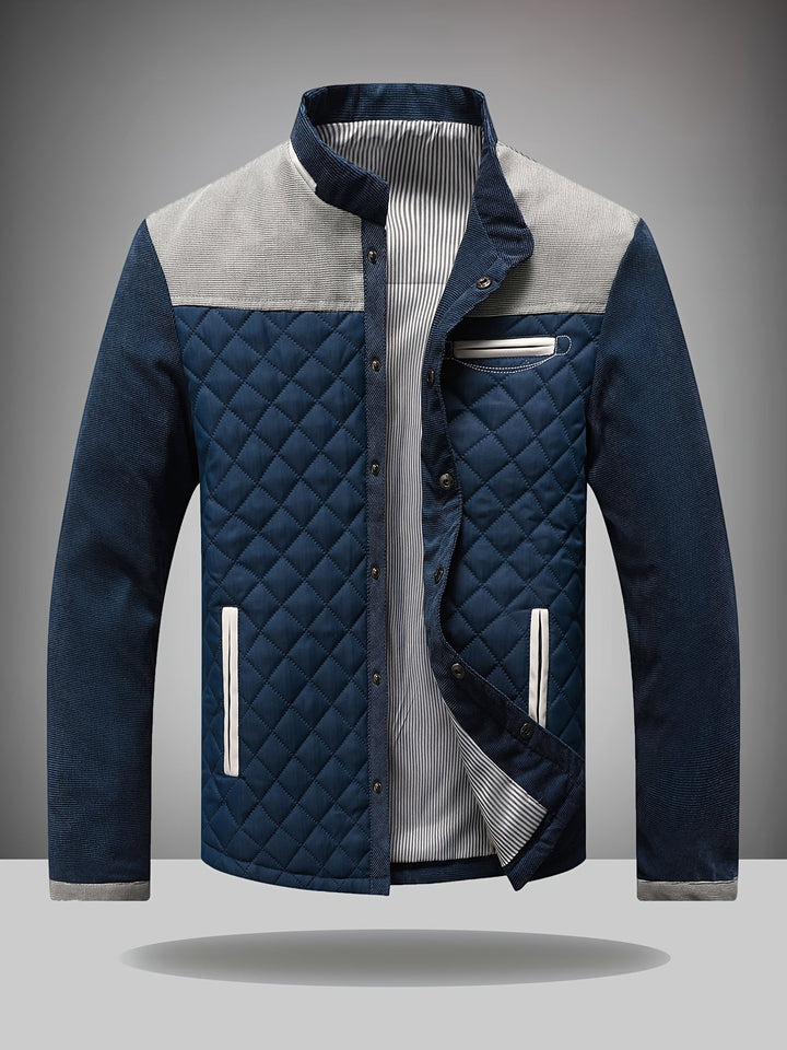 Navy quilted jacket with gray contrast yoke and zip pockets, front view