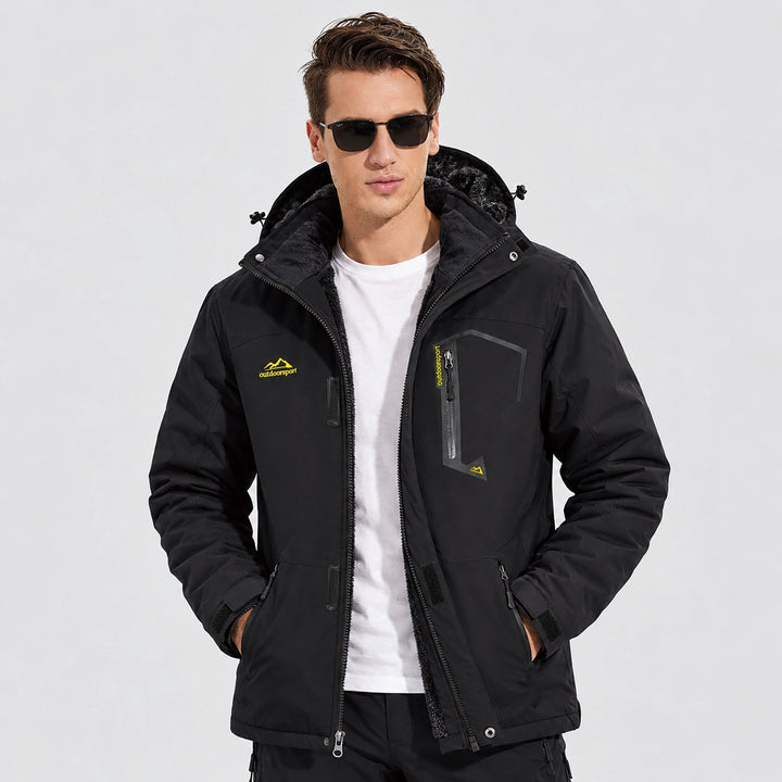 Man wearing the black ski jacket with hands in the pockets