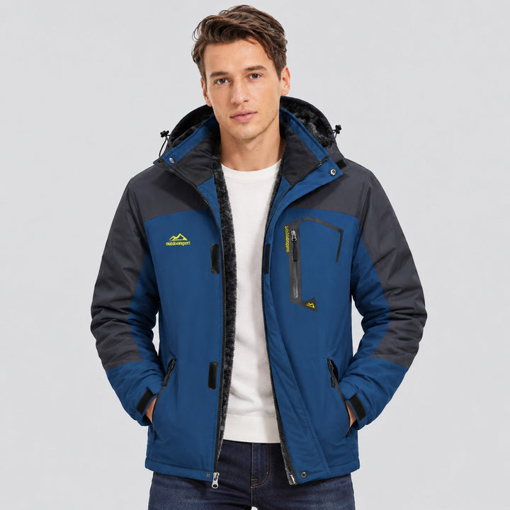 Man wearing the denim blue ski jacket open over a white tee