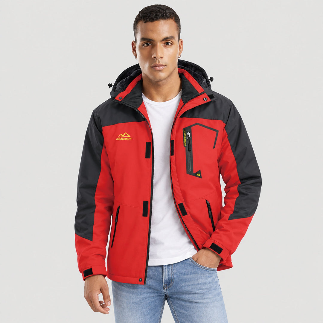 Man wearing the red ski jacket open over a white tee