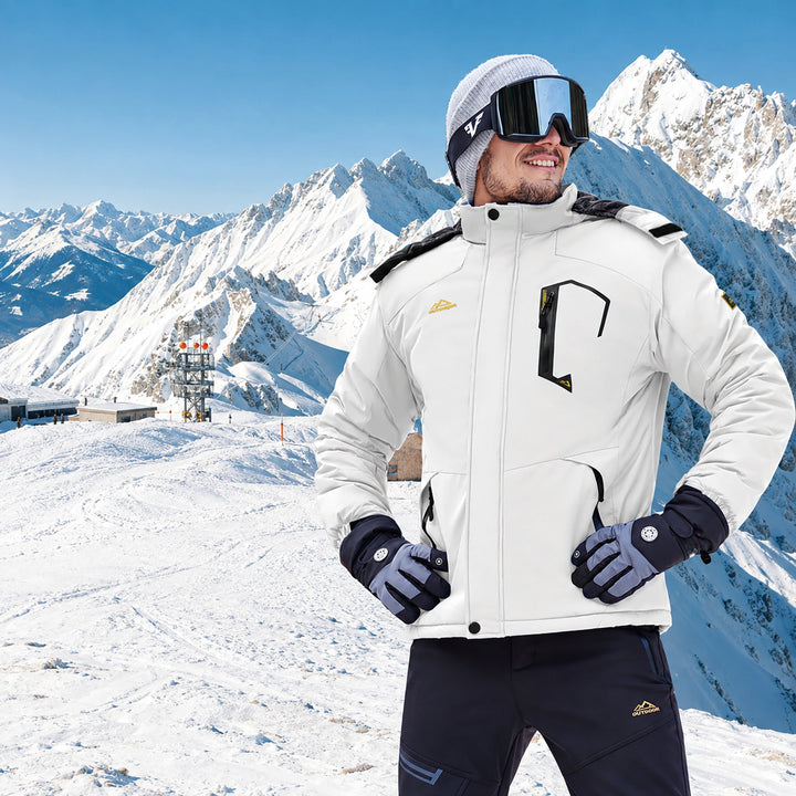Skier in the white jacket standing on a sunny mountain top