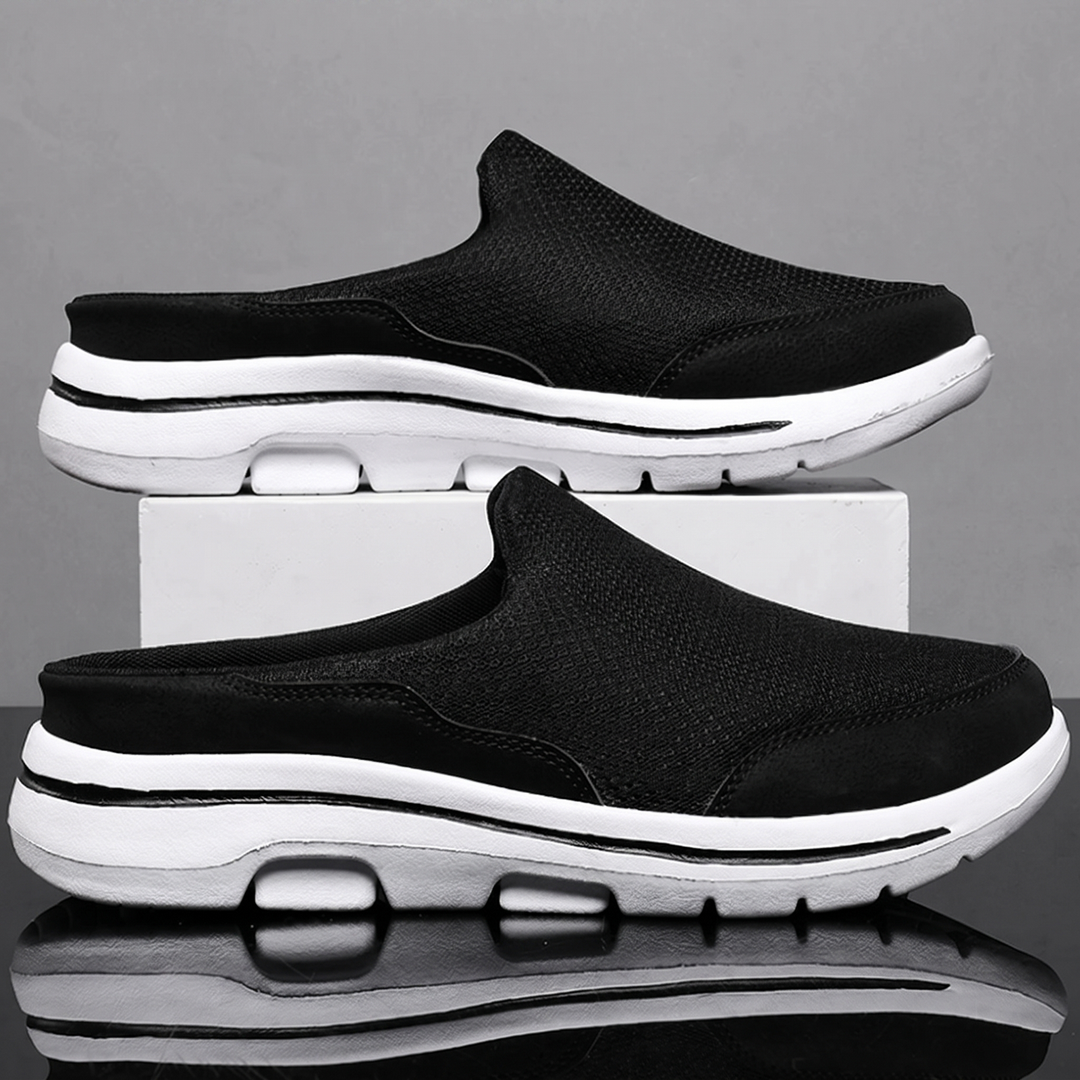 Black backless slip on sneakers with white cushioned sole
