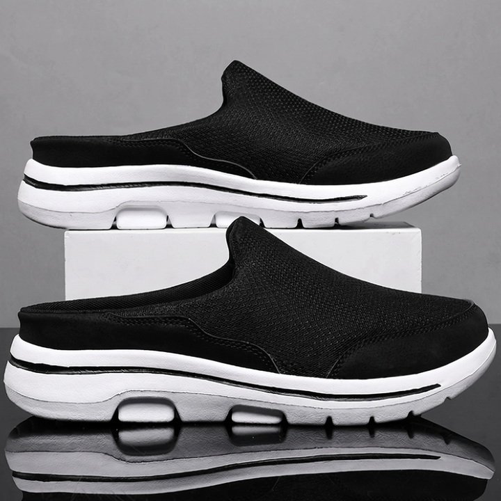 Black backless slip on sneakers with white cushioned sole