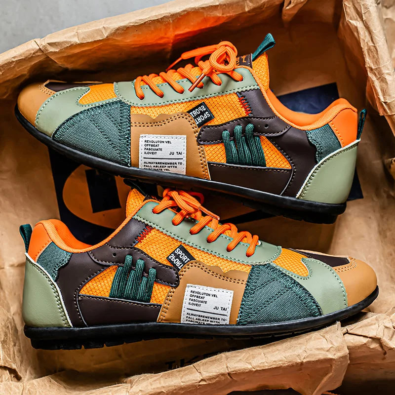 Men's sneakers in orange retro color block, pair resting in a paper-lined box