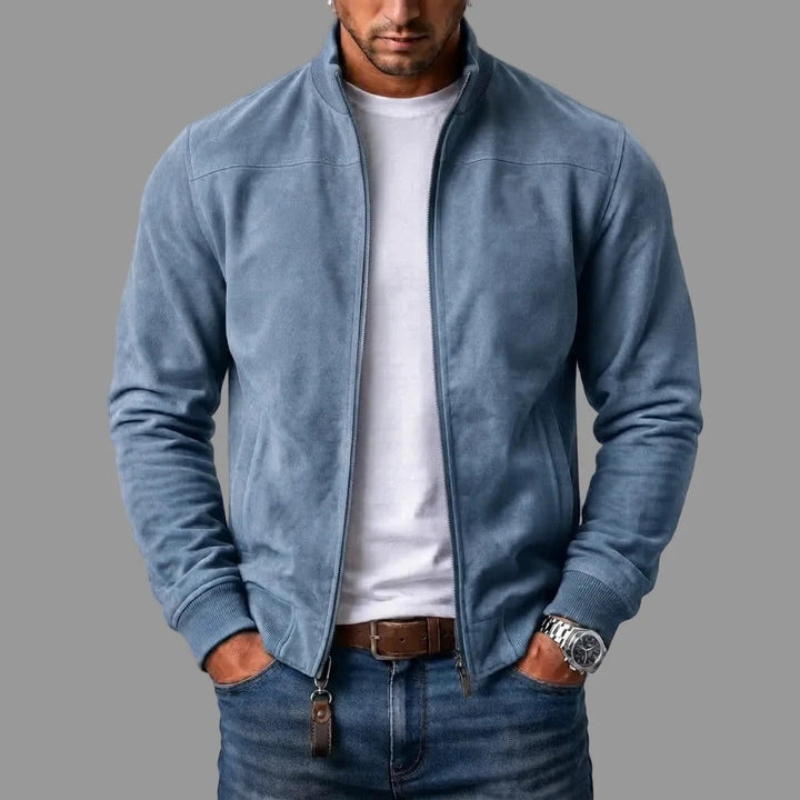 Light blue stand collar jacket zipped up, worn over a white t-shirt and denim