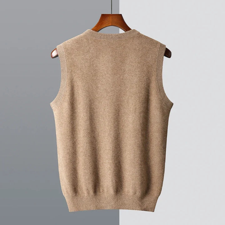 Back view of the camel knit vest showing the ribbed armholes and hem