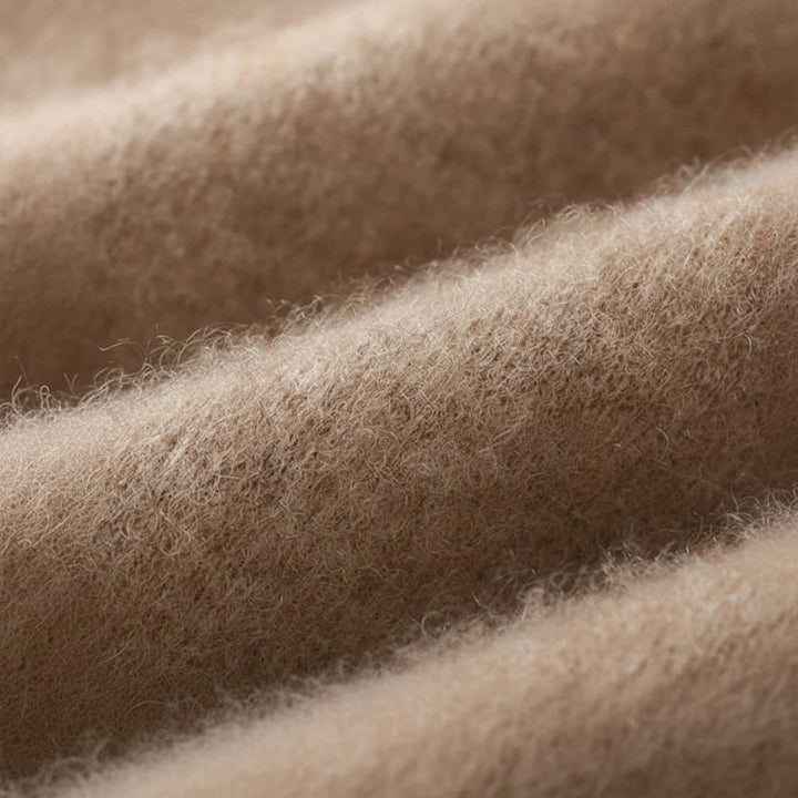 Macro view of the soft brushed knit texture in camel