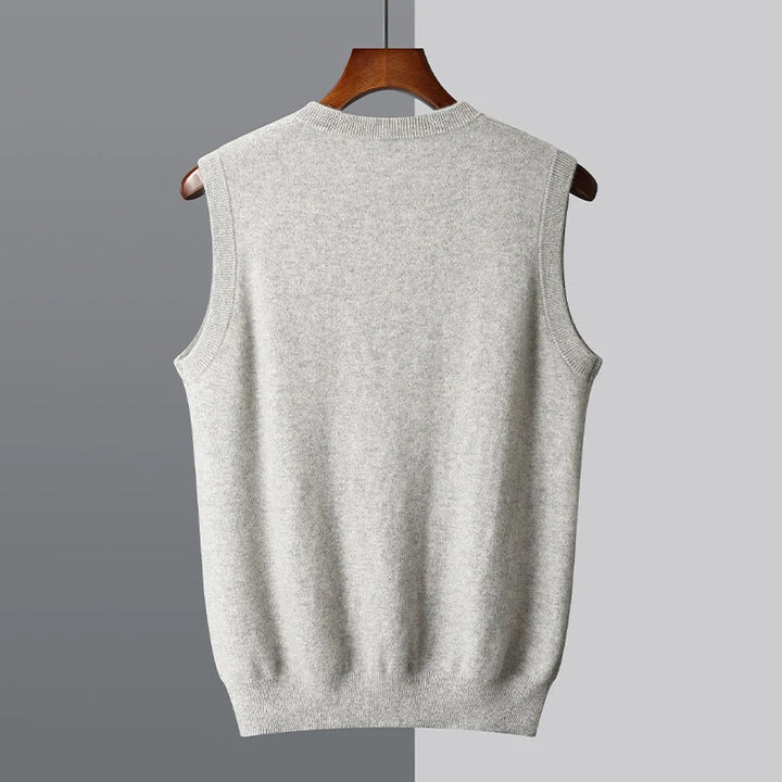 Light gray knit vest seen from the back with a ribbed hem