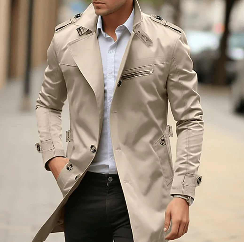 Men's trench coat in beige with epaulettes, worn over a white shirt