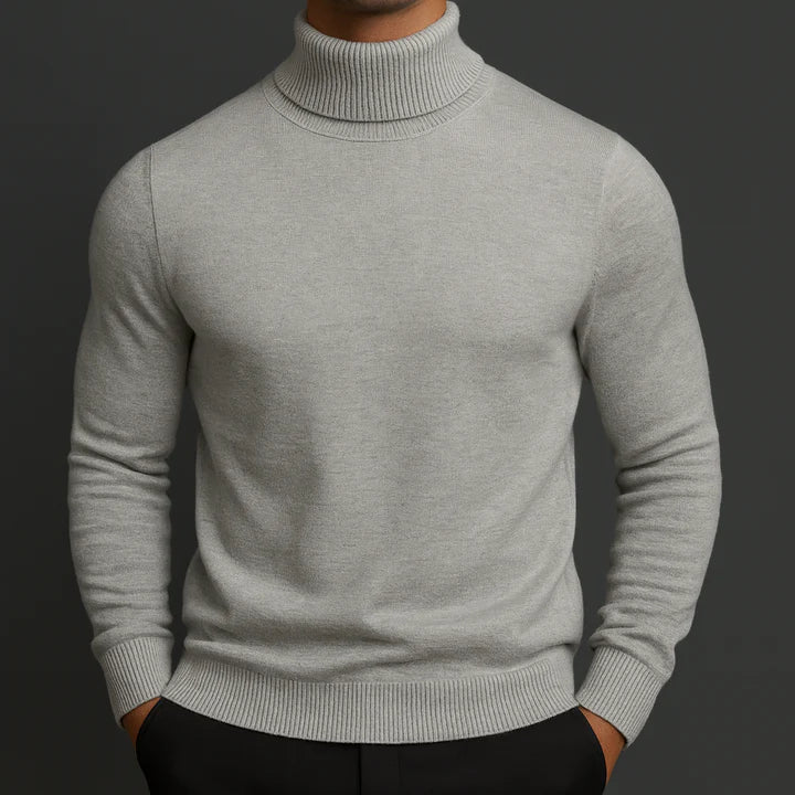 Man wearing a gray turtleneck knit pullover, front view