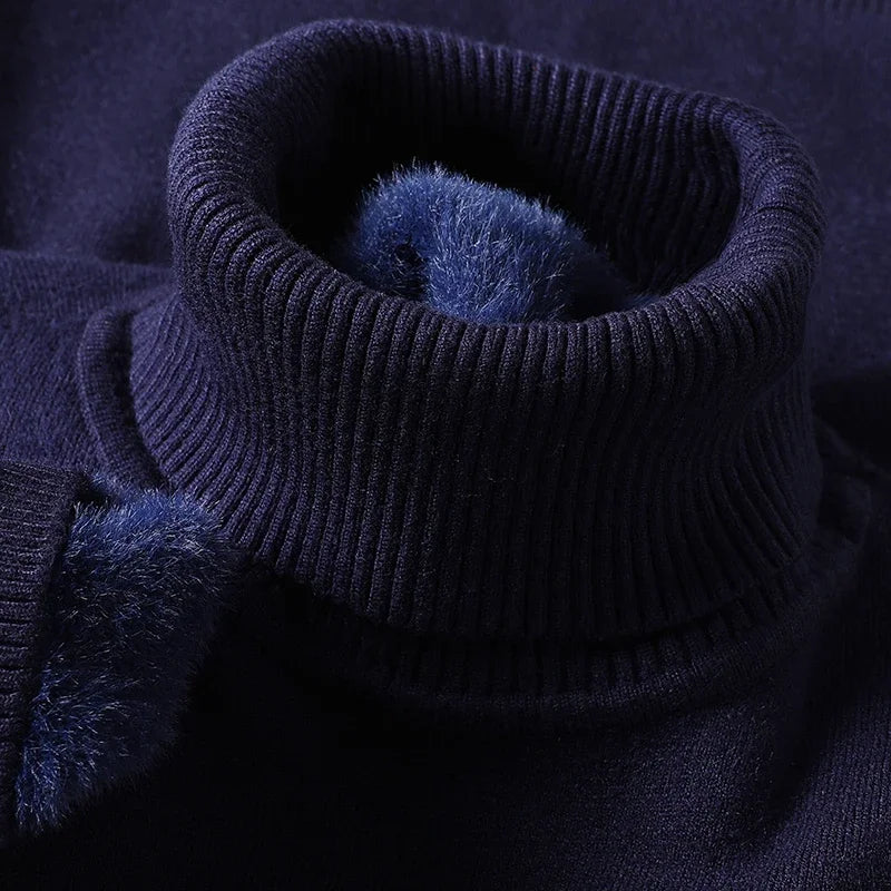 Close-up of the navy ribbed turtleneck collar with fleece lining