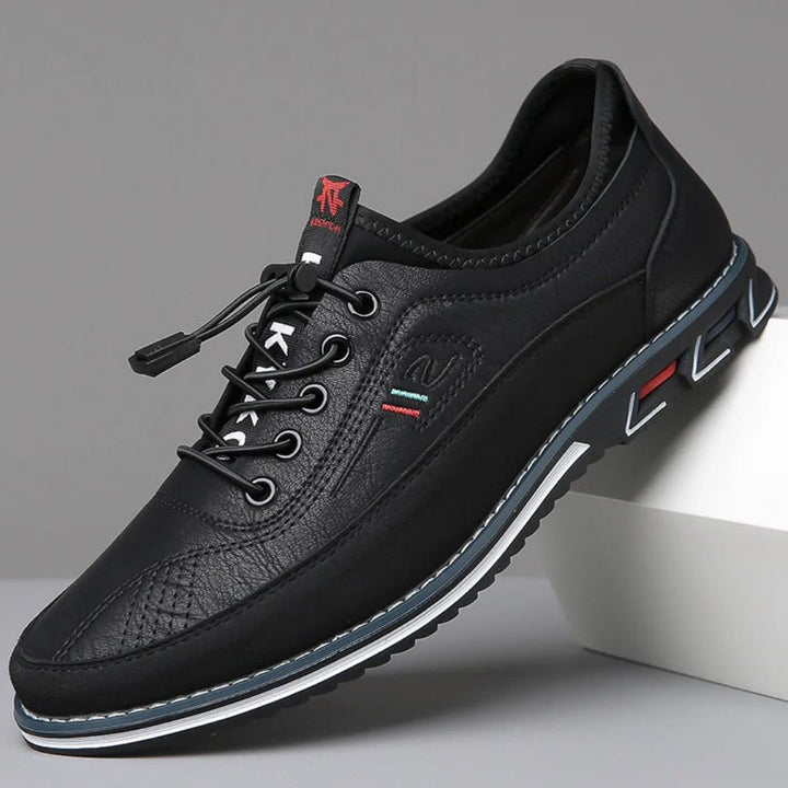 Black elastic lace walking shoe with dark sole, side view