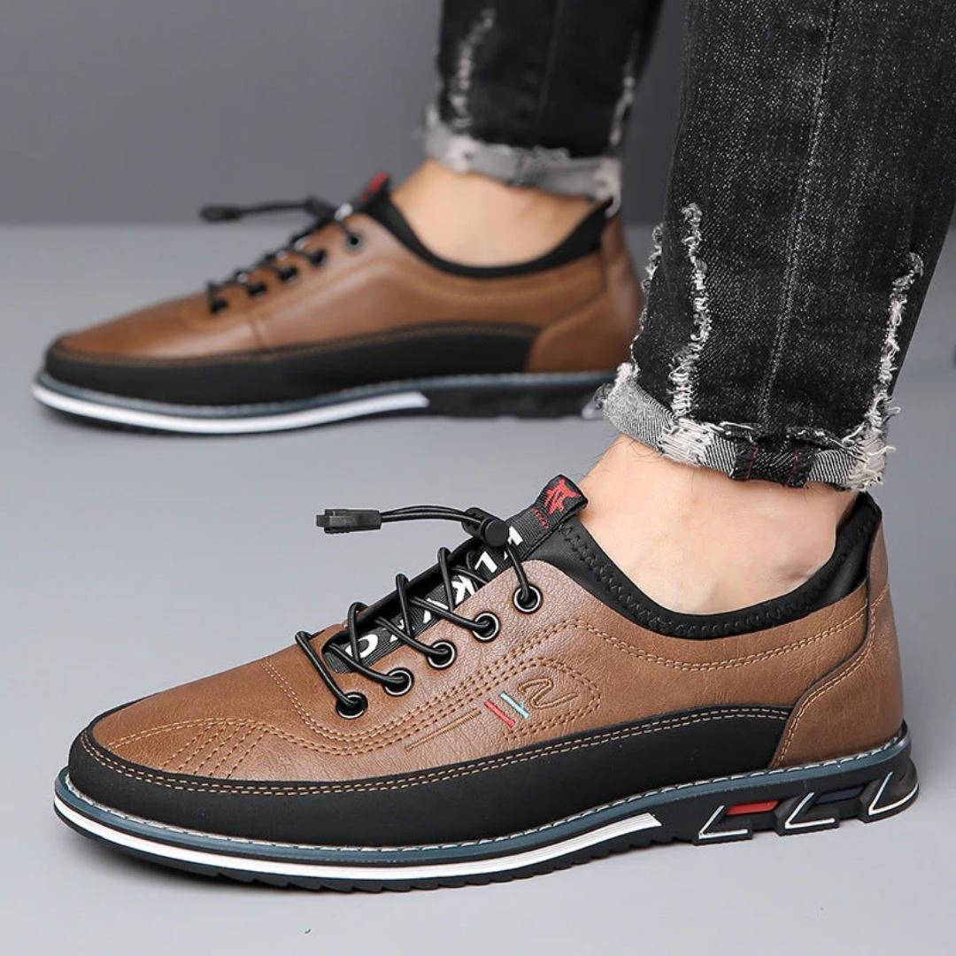 Brown elastic lace two tone sneakers worn with jeans