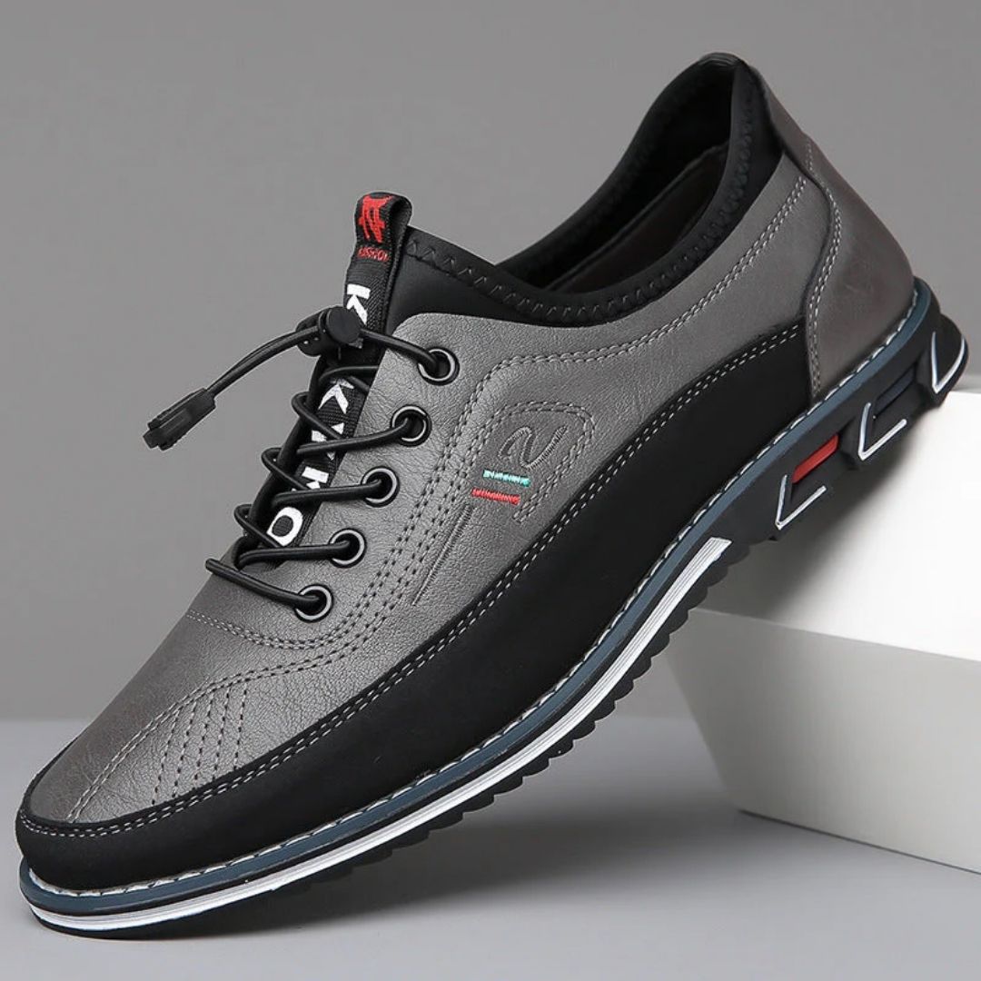 Gray two tone elastic lace walking shoe with black sole, side view