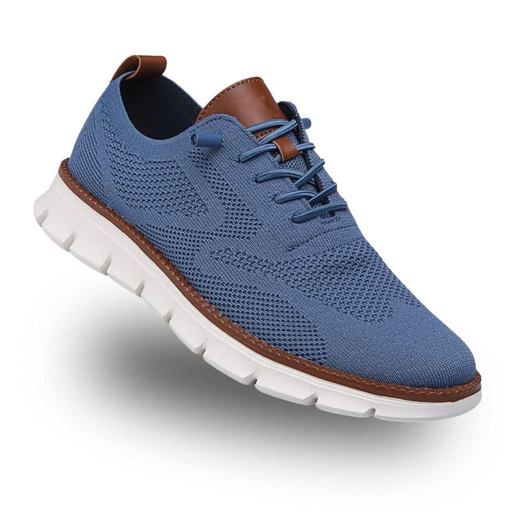 Blue knit lace-up sneaker with brown heel tab and white sole, three-quarter view