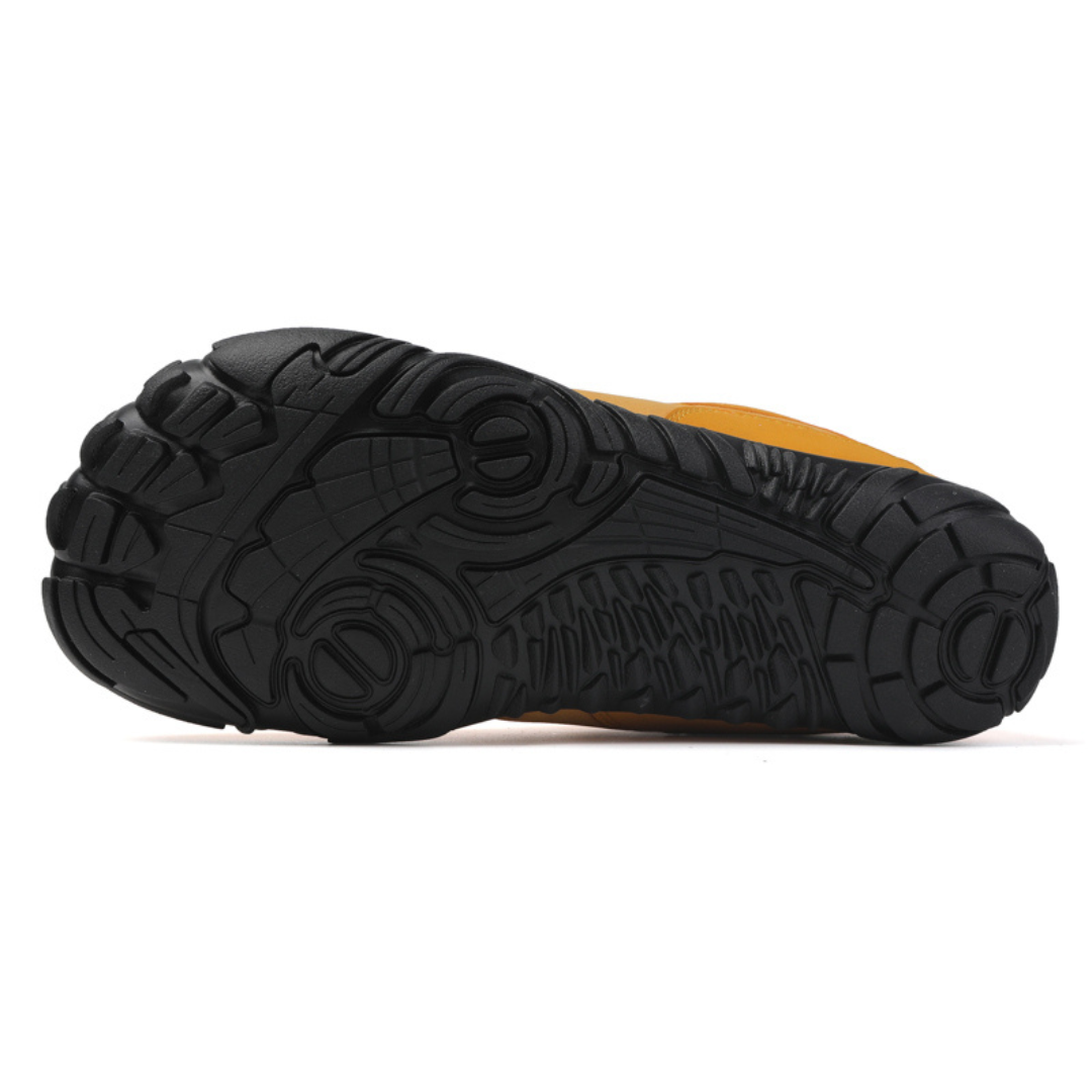 Underside of the mustard boot showing the black wide toe tread