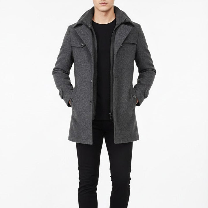 Man wearing the dark gray double collar coat over a black tee