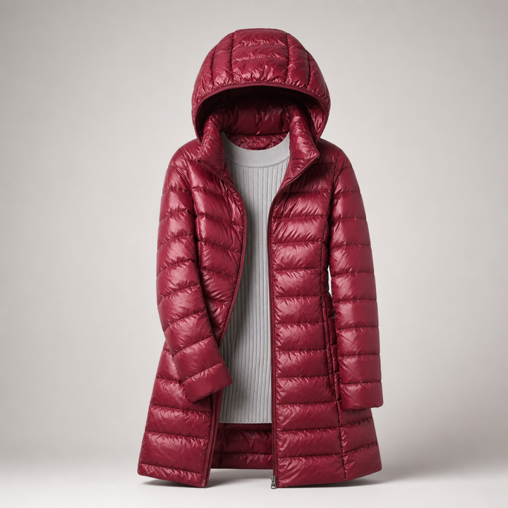Red long quilted puffer coat with hood, front view over a gray top