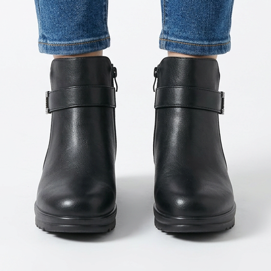 Front view of black wedge ankle boots with buckle strap and side zip