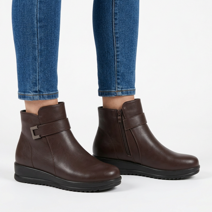 Dark brown buckle strap wedge ankle boots, three-quarter view