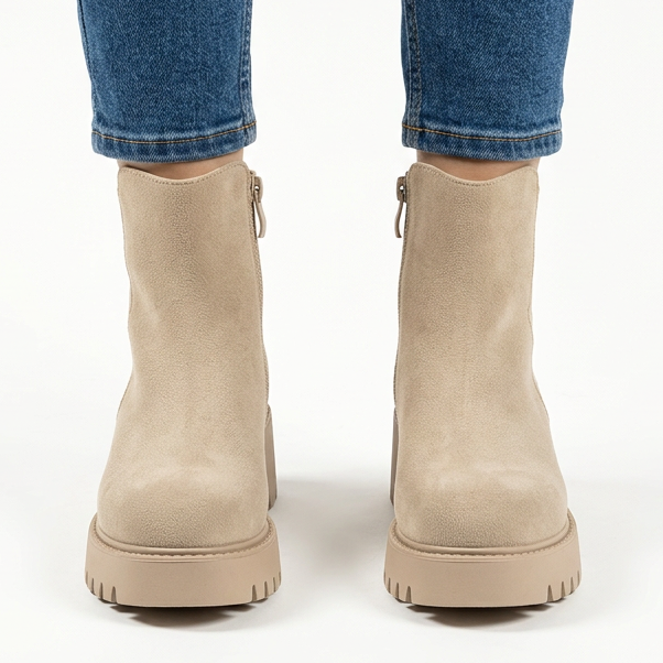 Front view of beige chunky suede-look ankle boots with side zip